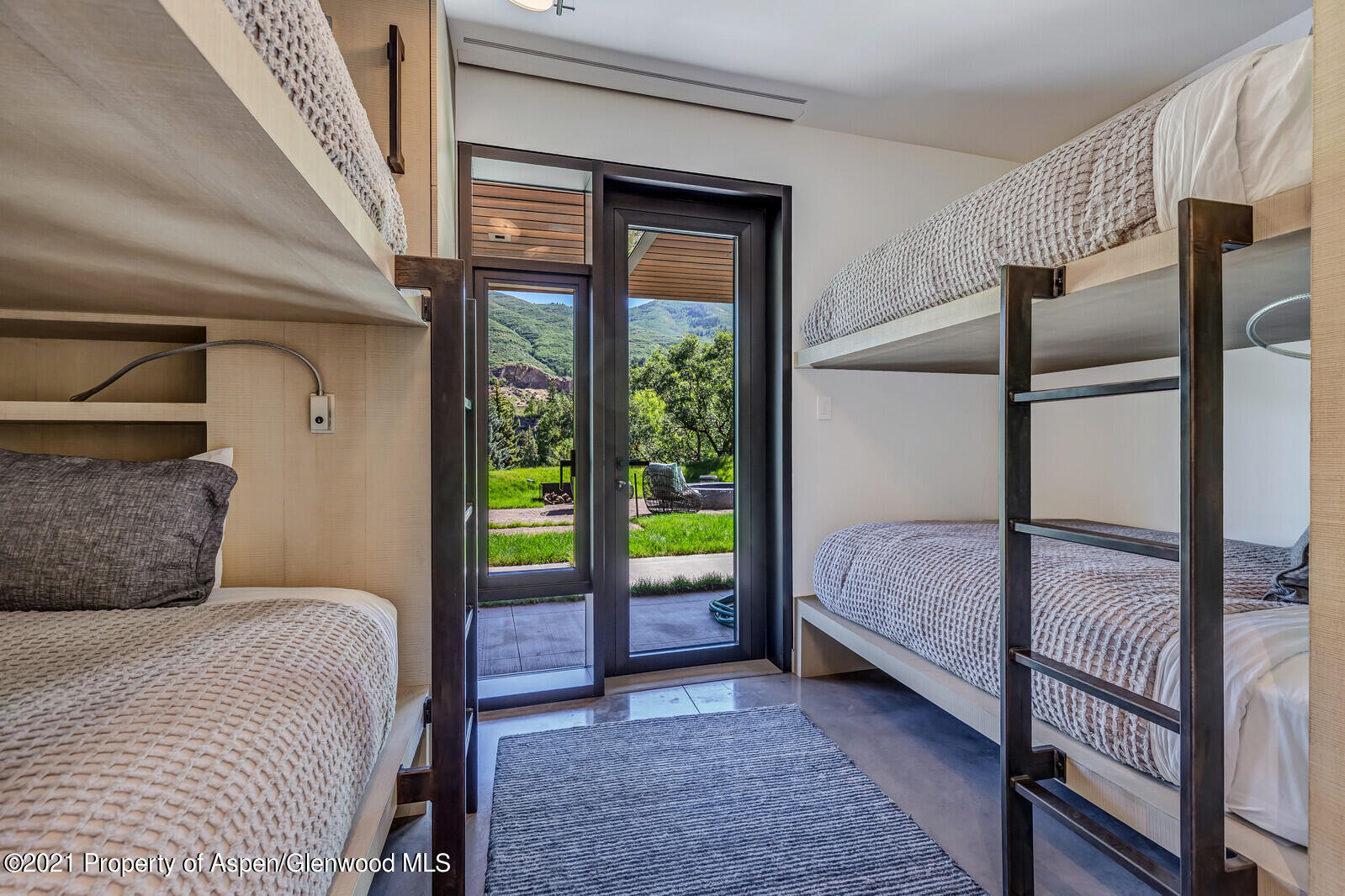 276 Coach Road Aspen, CO 81611 - Photo 62 of 68 a bedroom with a bed and a window