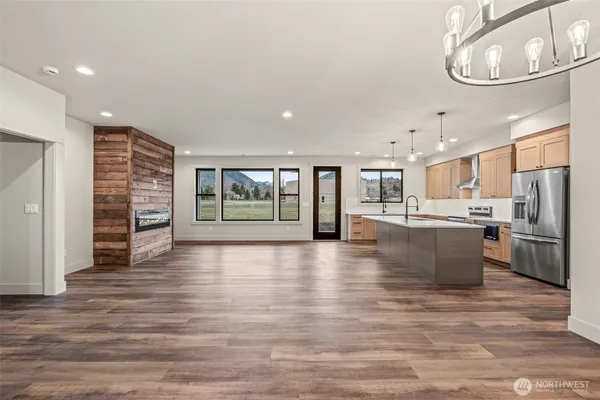 a view of kitchen with furniture and refrigerator