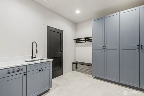 a kitchen with a sink and cabinets