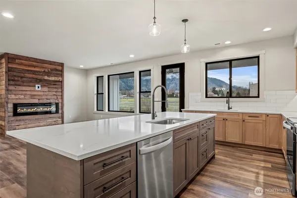 a kitchen with a stove a sink and a refrigerator