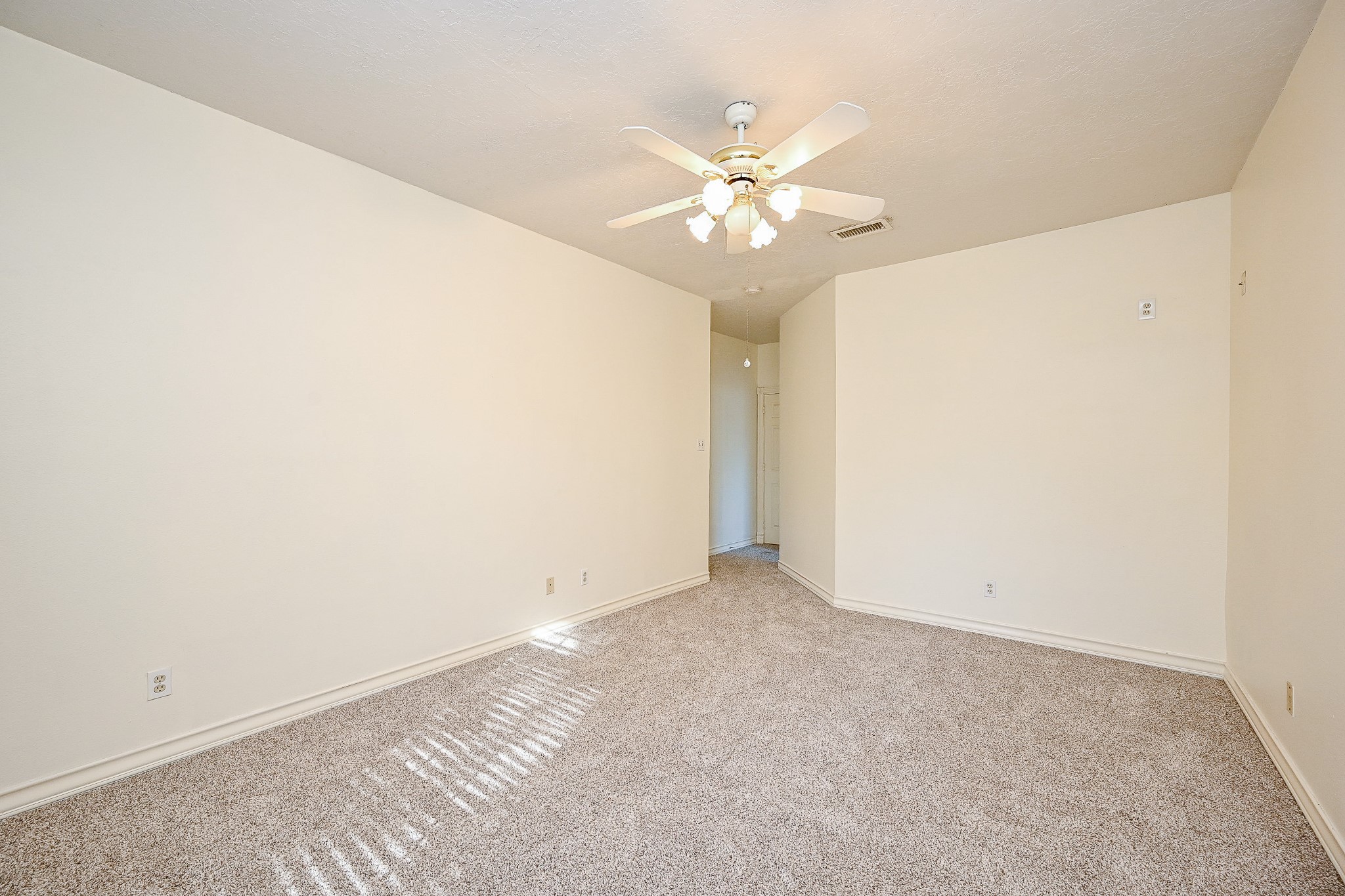 26824 Victory Lane Spring, TX 77386 - Photo 12 of 27 an empty room with a chandelier fan and a window