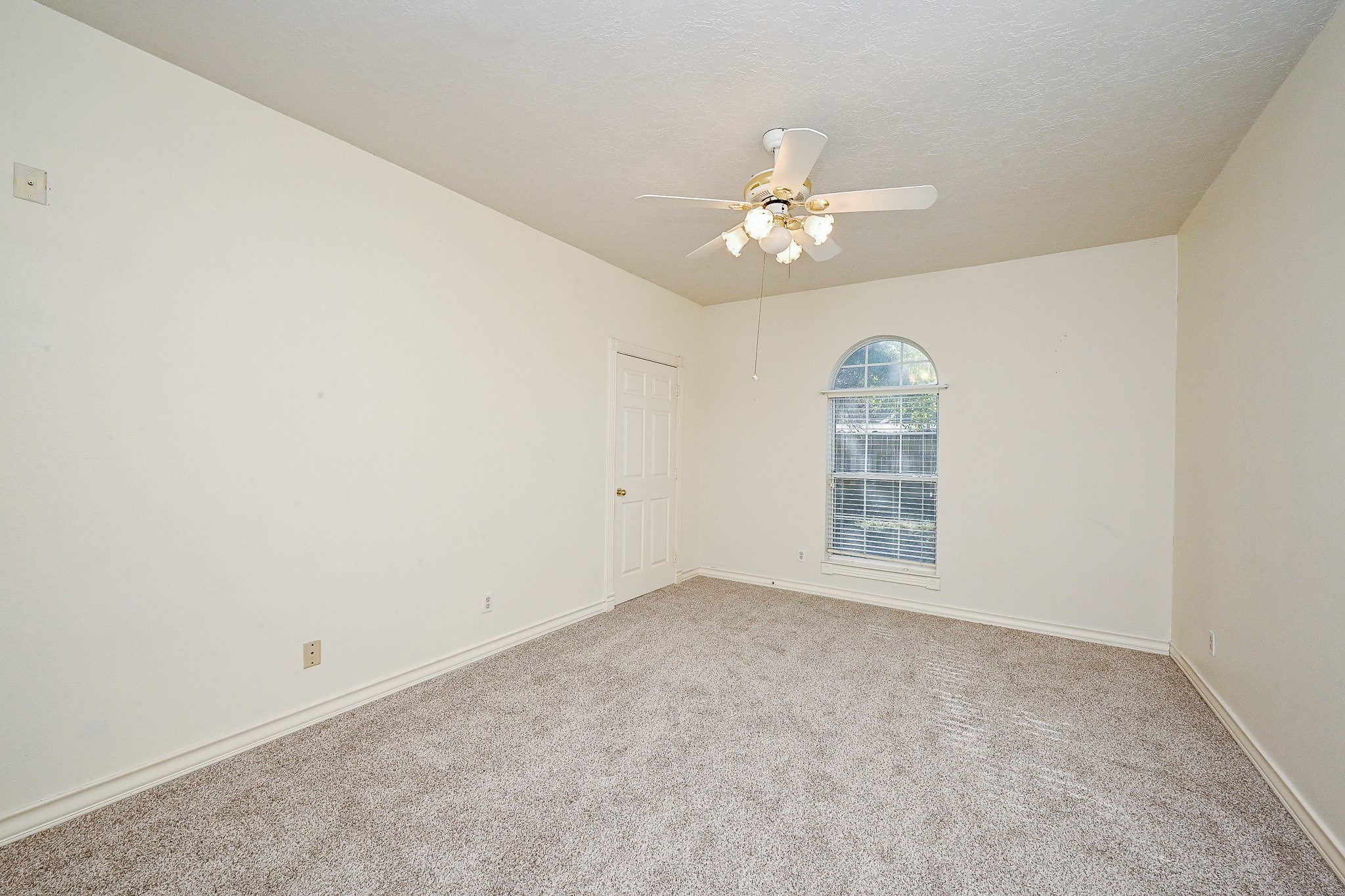 26824 Victory Lane Spring, TX 77386 - Photo 13 of 27 an empty room with a window and ceiling fan