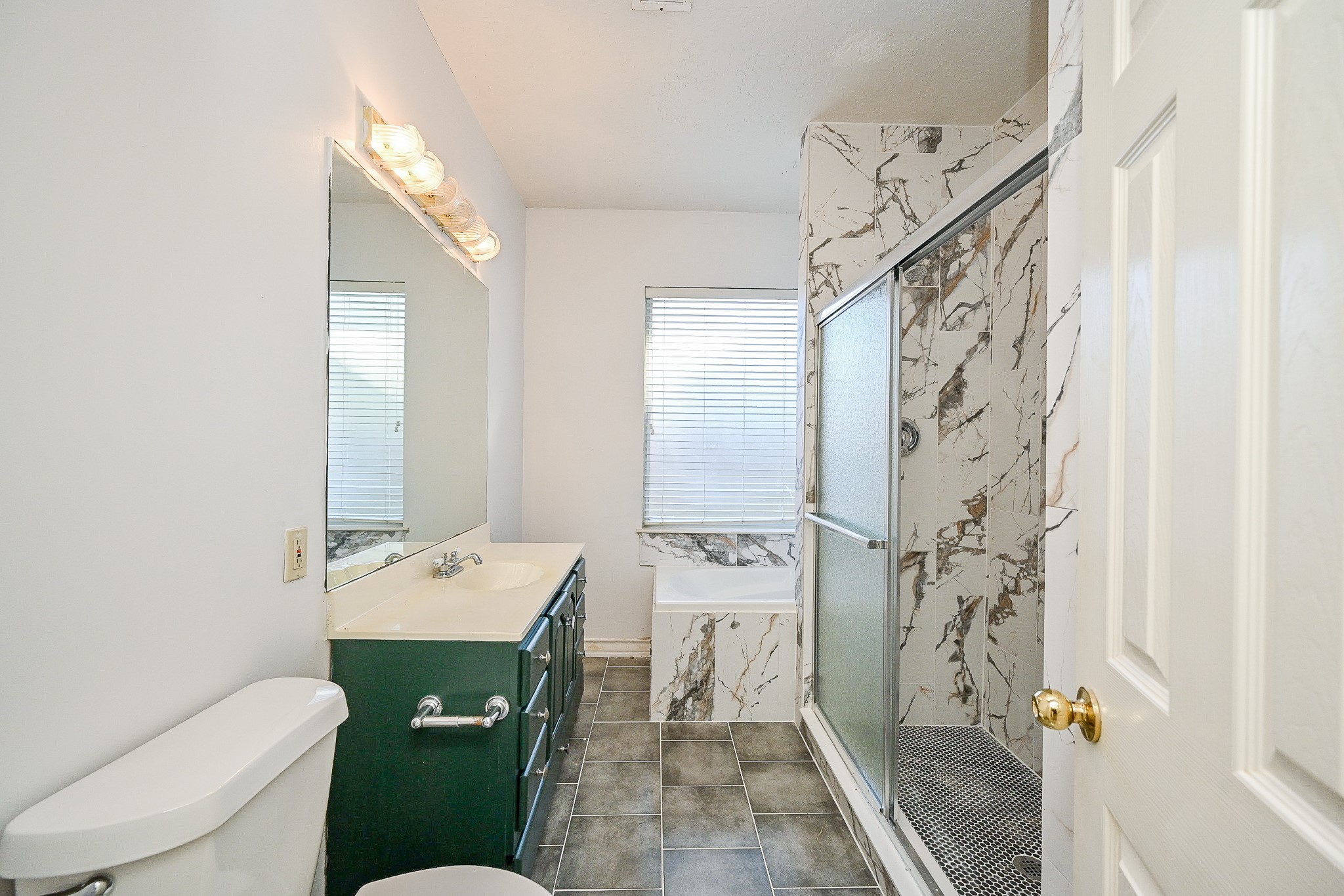 26824 Victory Lane Spring, TX 77386 - Photo 15 of 27 a bathroom with a sink toilet and shower