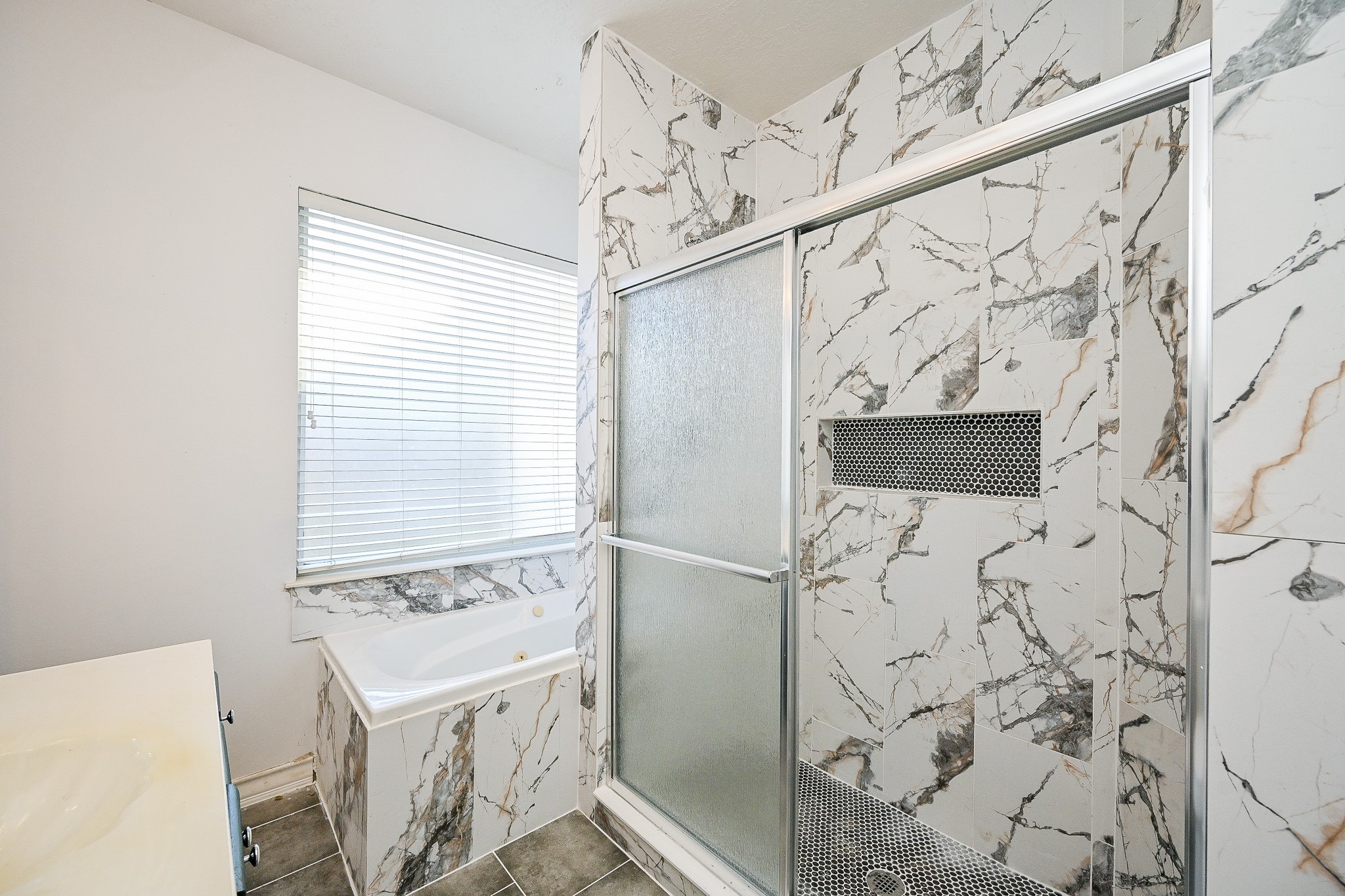 26824 Victory Lane Spring, TX 77386 - Photo 16 of 27 a bathroom with a bathtub and shower
