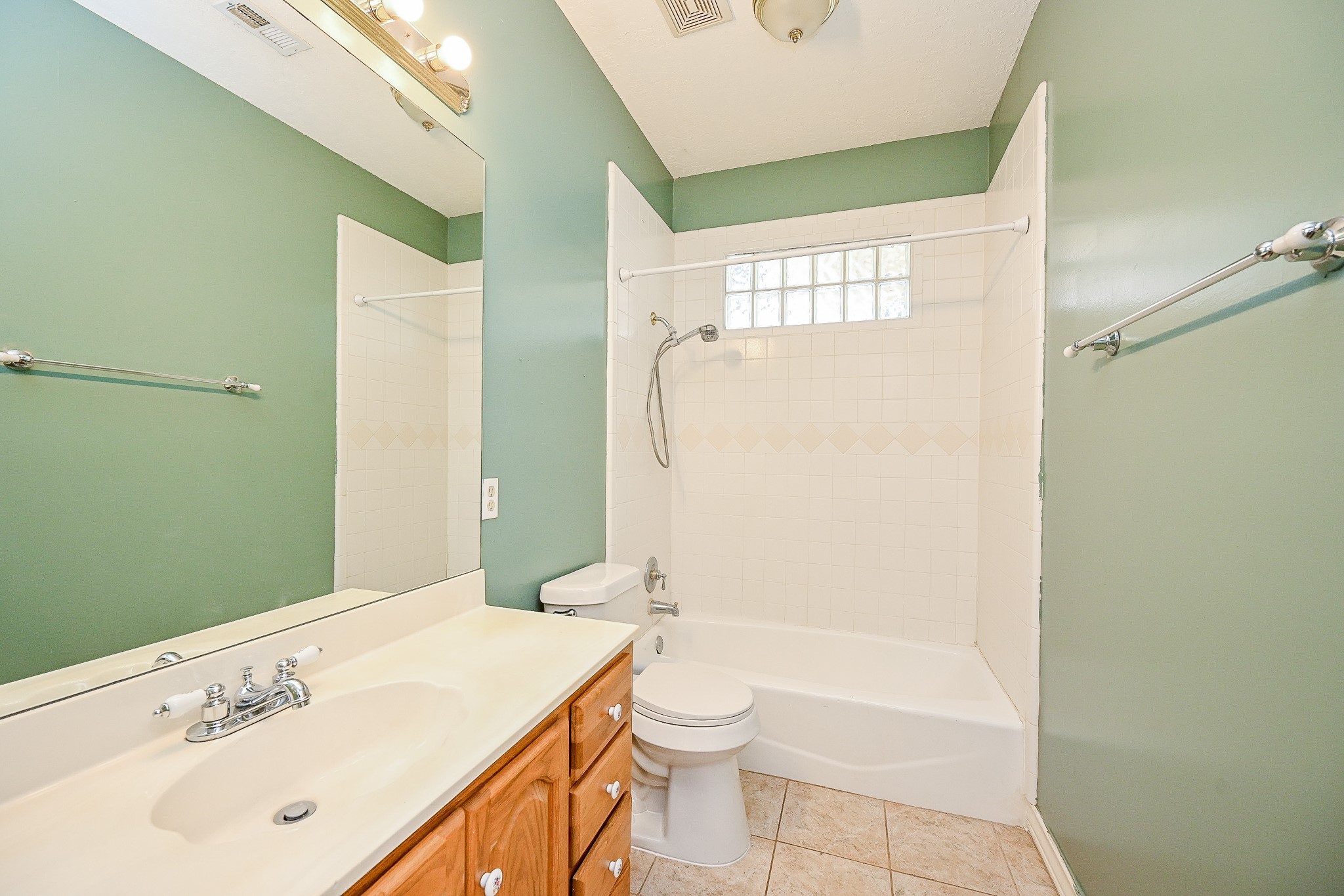 26824 Victory Lane Spring, TX 77386 - Photo 19 of 27 a bathroom with a sink a toilet and shower