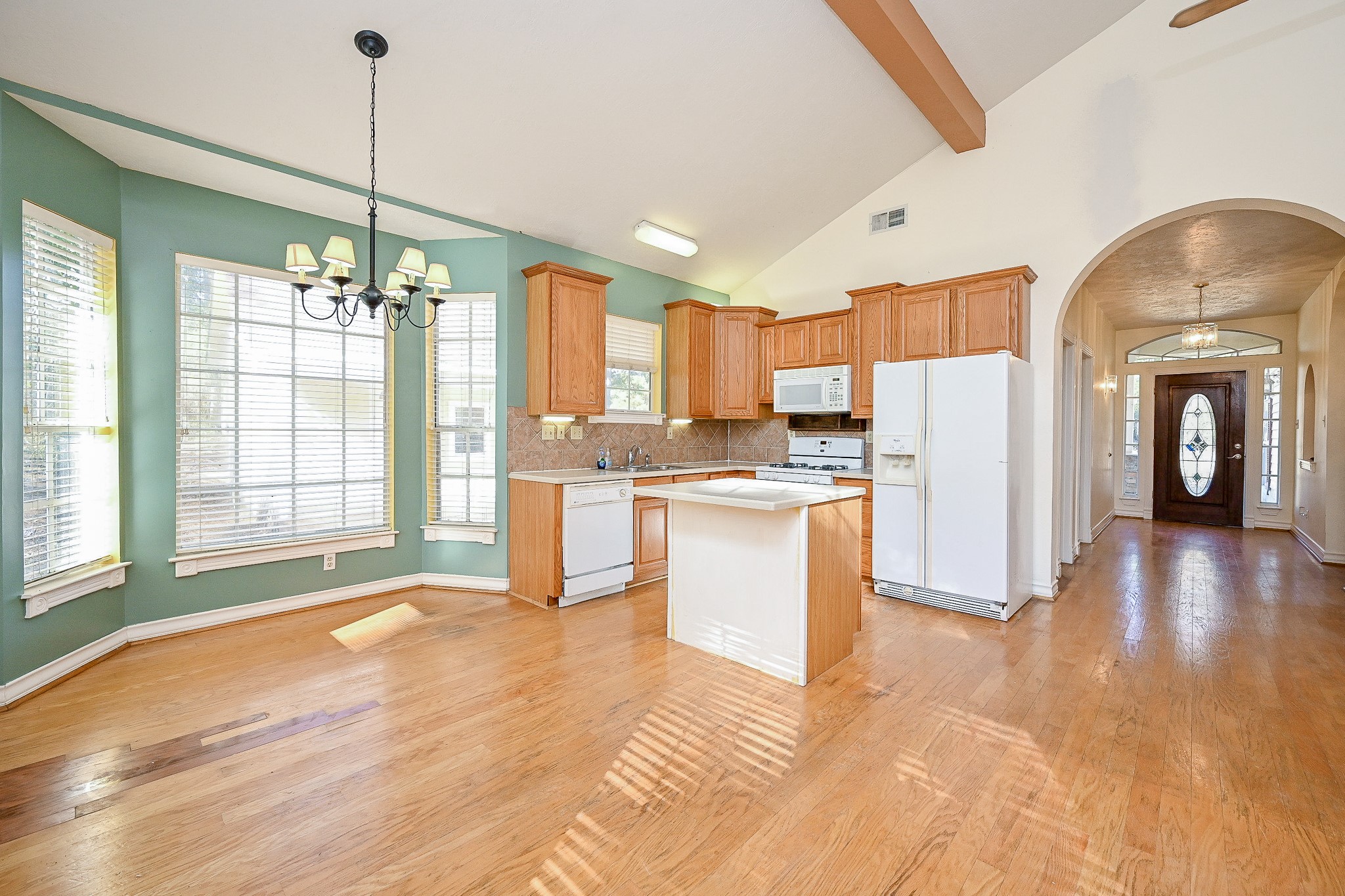 26824 Victory Lane Spring, TX 77386 - Photo 6 of 27 a view of a kitchen with refrigerator and wooden floor