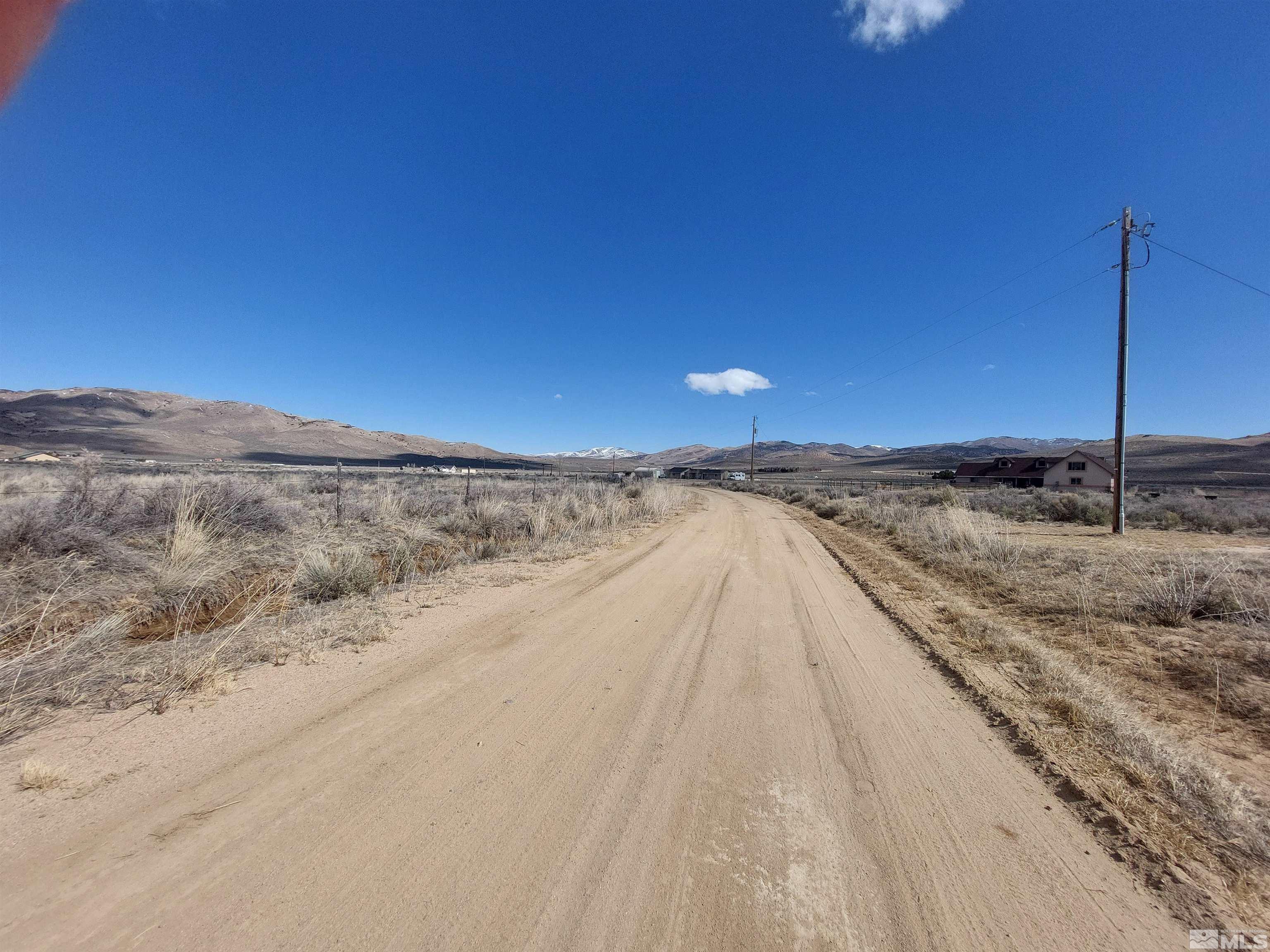 85 Buckboard Circle Reno, NV 89508 - Photo 4 of 14 a view of a dry yard with wooden fence