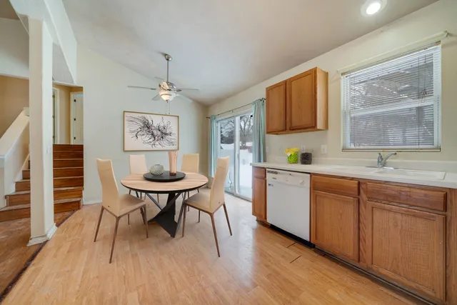 a kitchen with sink cabinets and wooden floor