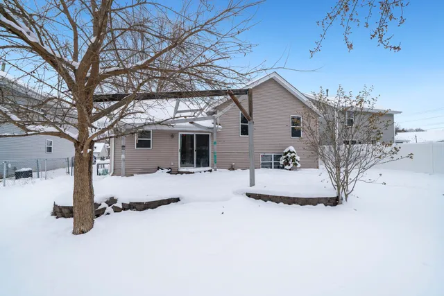 a view of a house with a snow in the yard