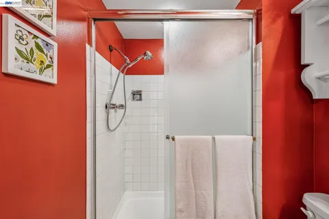 a bathroom with a shower and a tub
