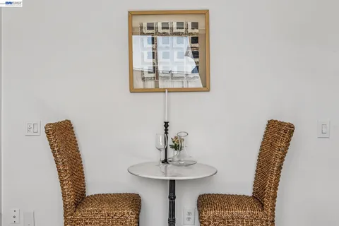 a view of a hallway with couches and a potted plant