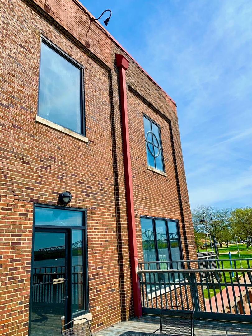 330 Southwest Water Street Peoria, IL 61602 - Photo 4 of 17 a brick building with a large windows