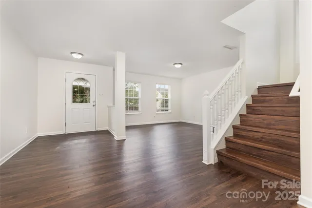 a view of an entryway with wooden floor