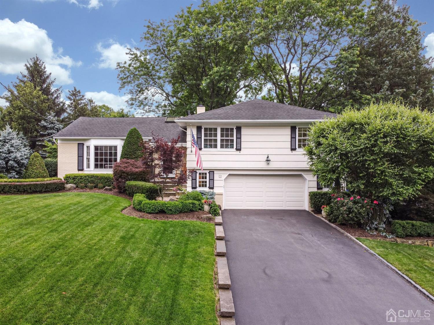 4 Moraine Road Edison, NJ 08820 - Photo 2 of 57 a front view of house with yard and green space