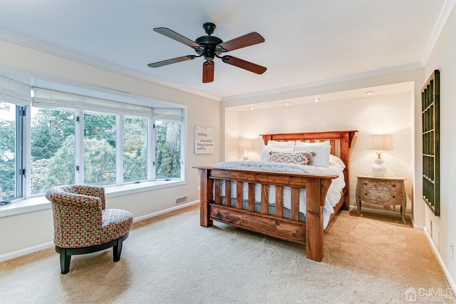 4 Moraine Road Edison, NJ 08820 - Photo 20 of 57 a bedroom with a bed and a chandelier