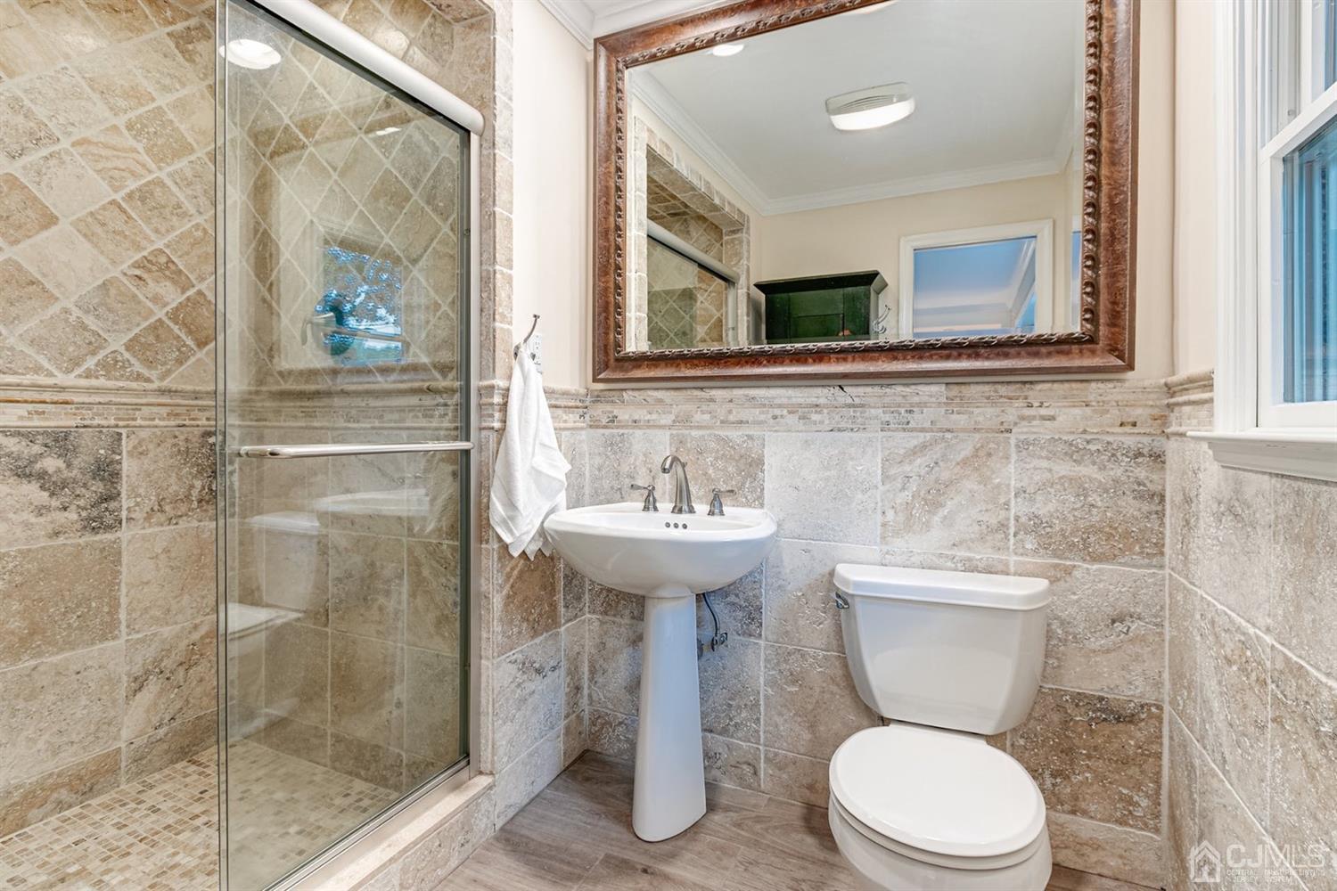 4 Moraine Road Edison, NJ 08820 - Photo 21 of 57 a bathroom with a toilet sink and shower