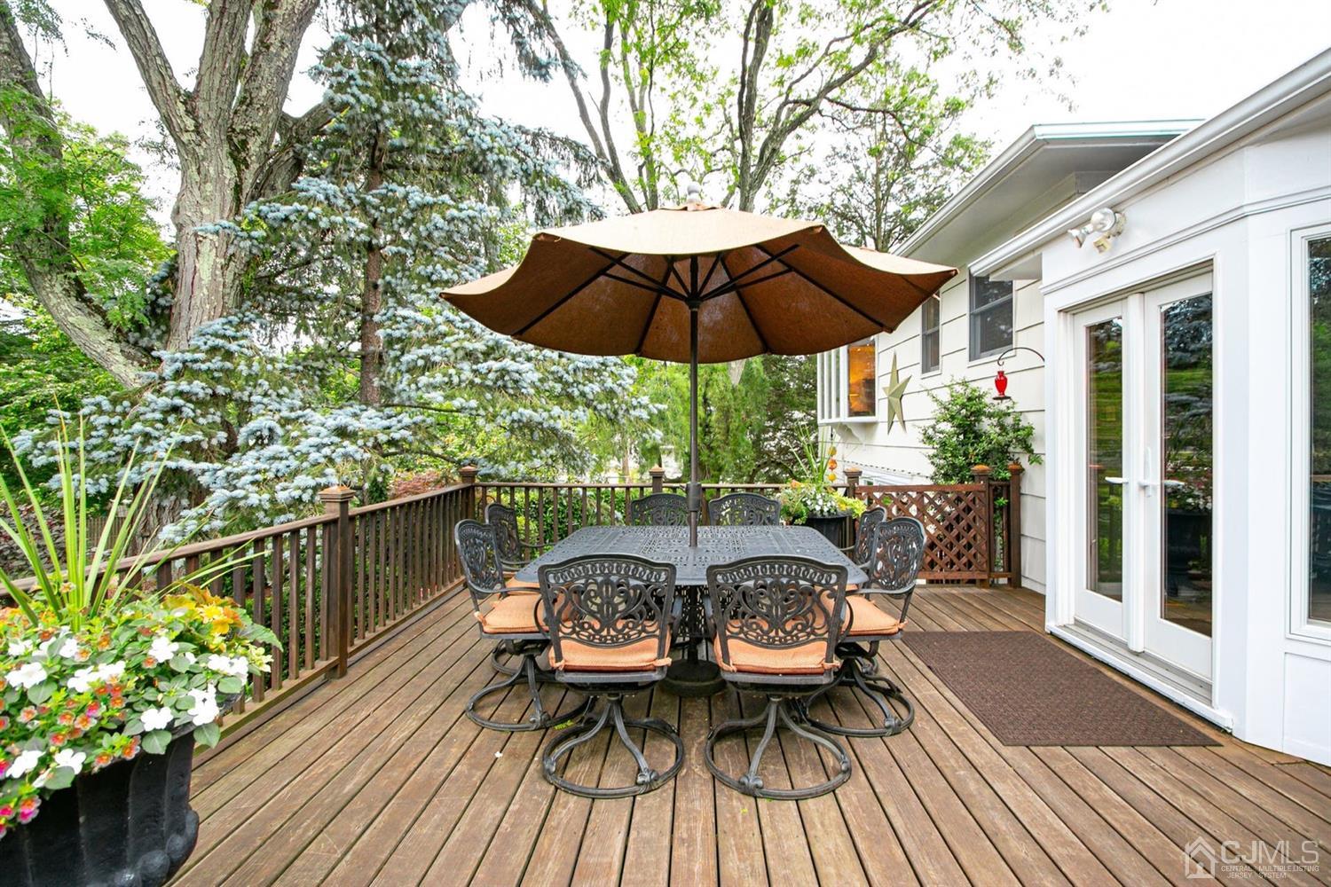 4 Moraine Road Edison, NJ 08820 - Photo 35 of 57 a view of balcony with outdoor seating and wooden floor