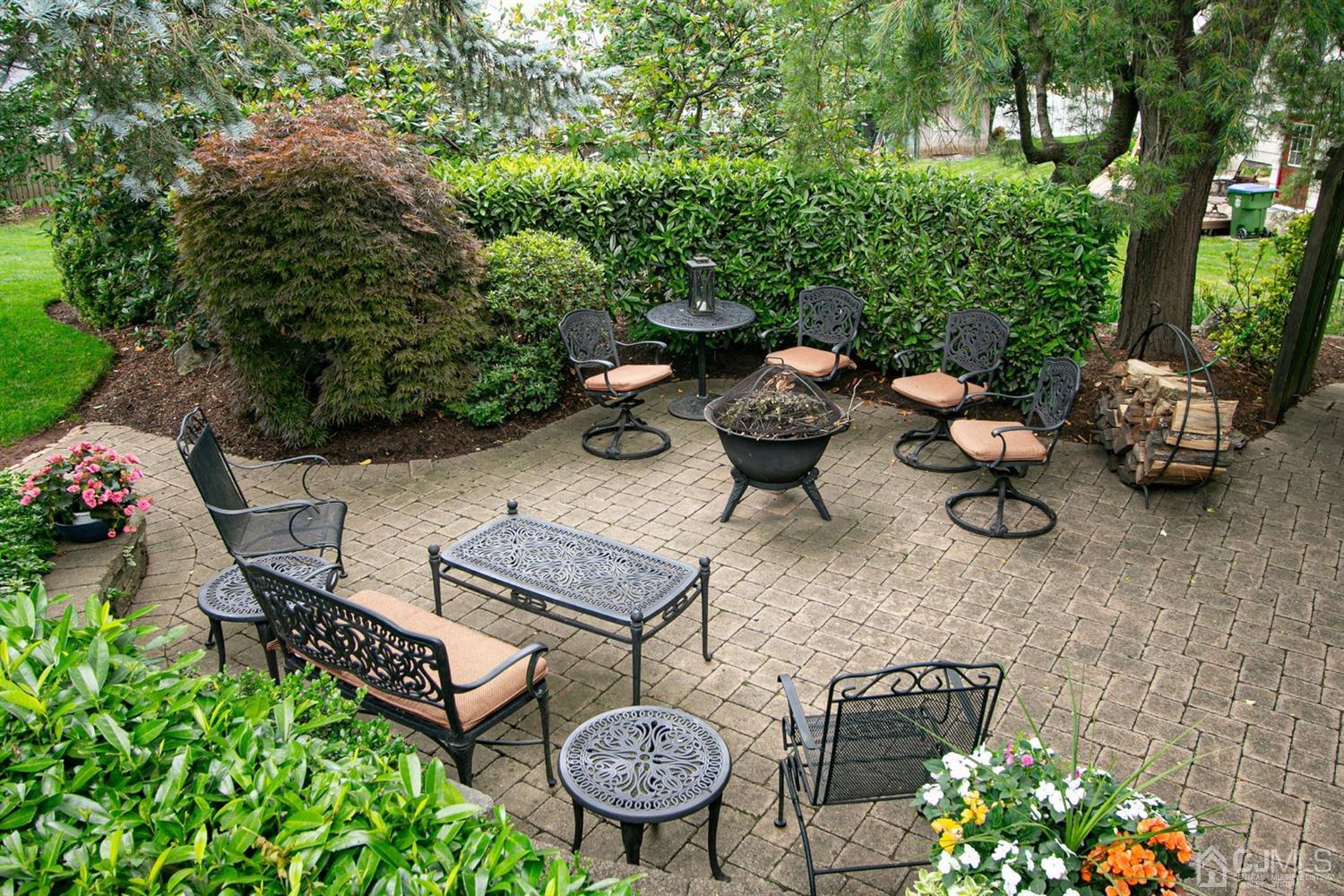4 Moraine Road Edison, NJ 08820 - Photo 37 of 57 a view of a backyard with sitting area and garden
