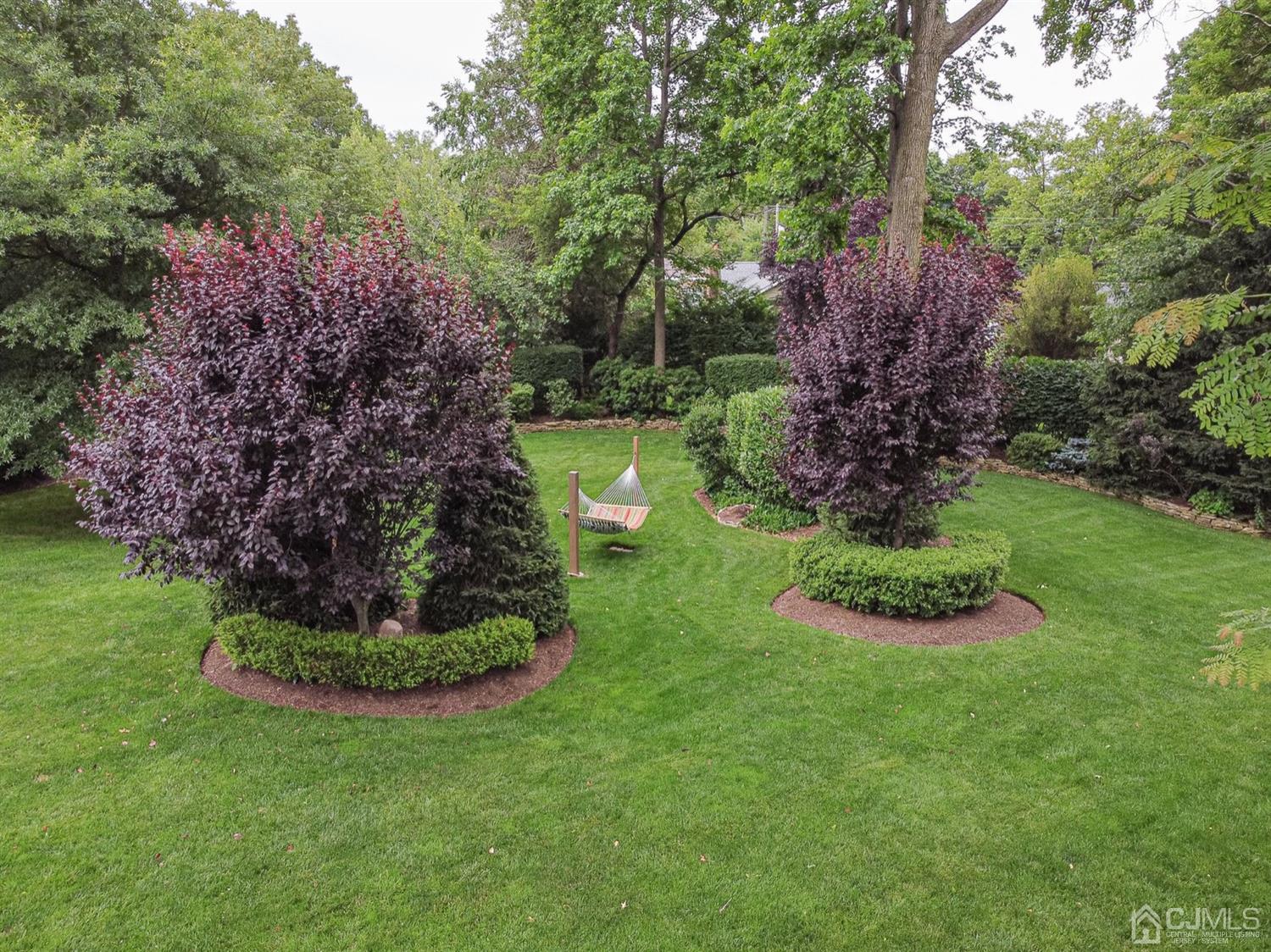 4 Moraine Road Edison, NJ 08820 - Photo 38 of 57 a view of a garden with a house in a park