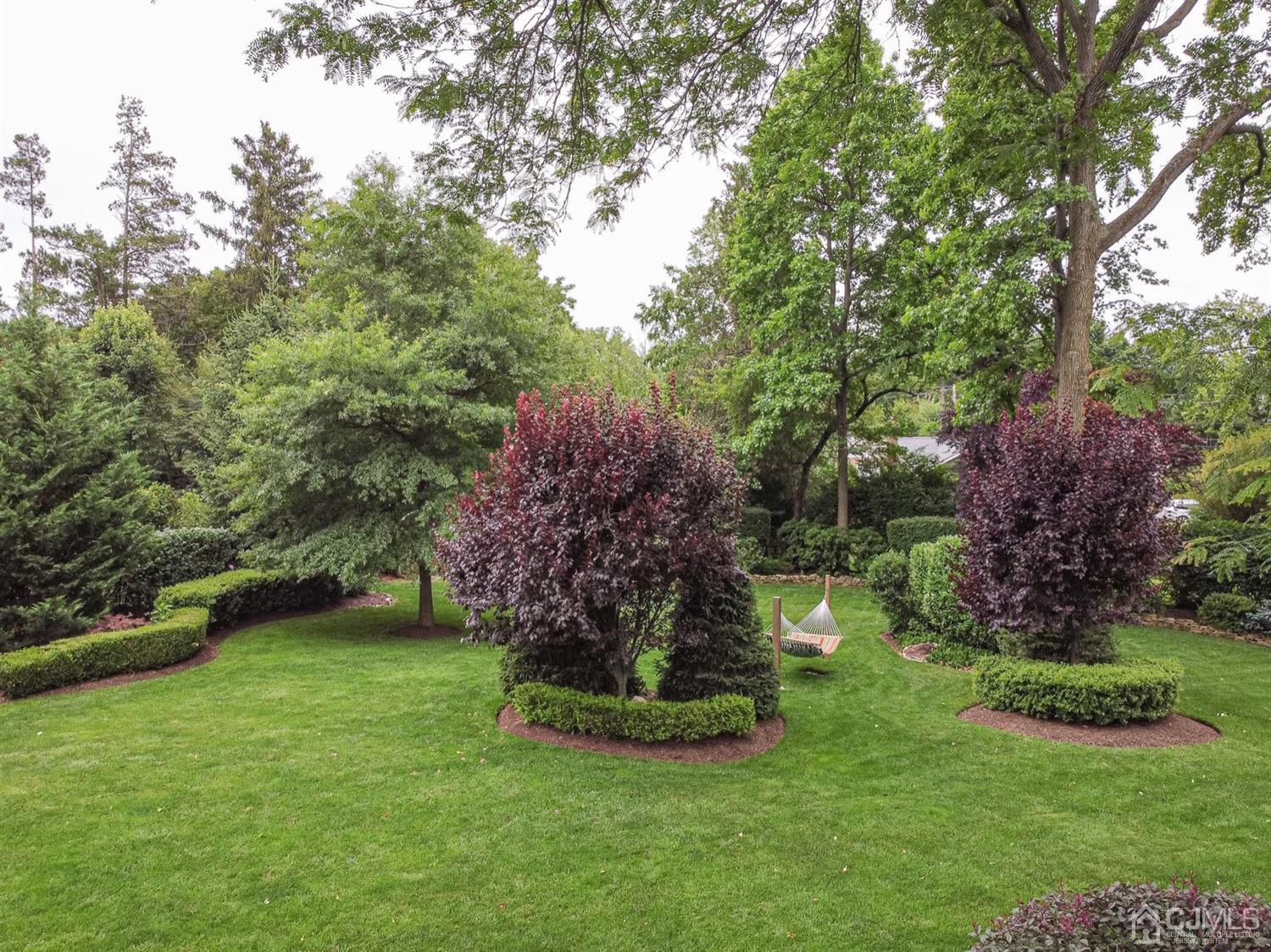 4 Moraine Road Edison, NJ 08820 - Photo 39 of 57 a garden with trees in the background