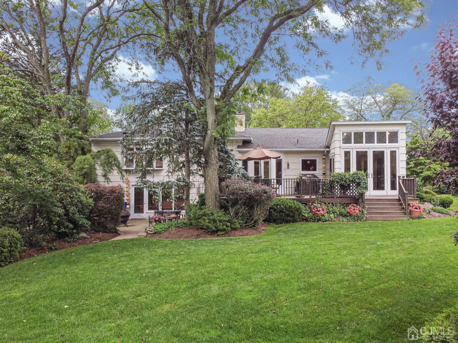 4 Moraine Road Edison, NJ 08820 - Photo 44 of 57 a view of a house with a garden and trees