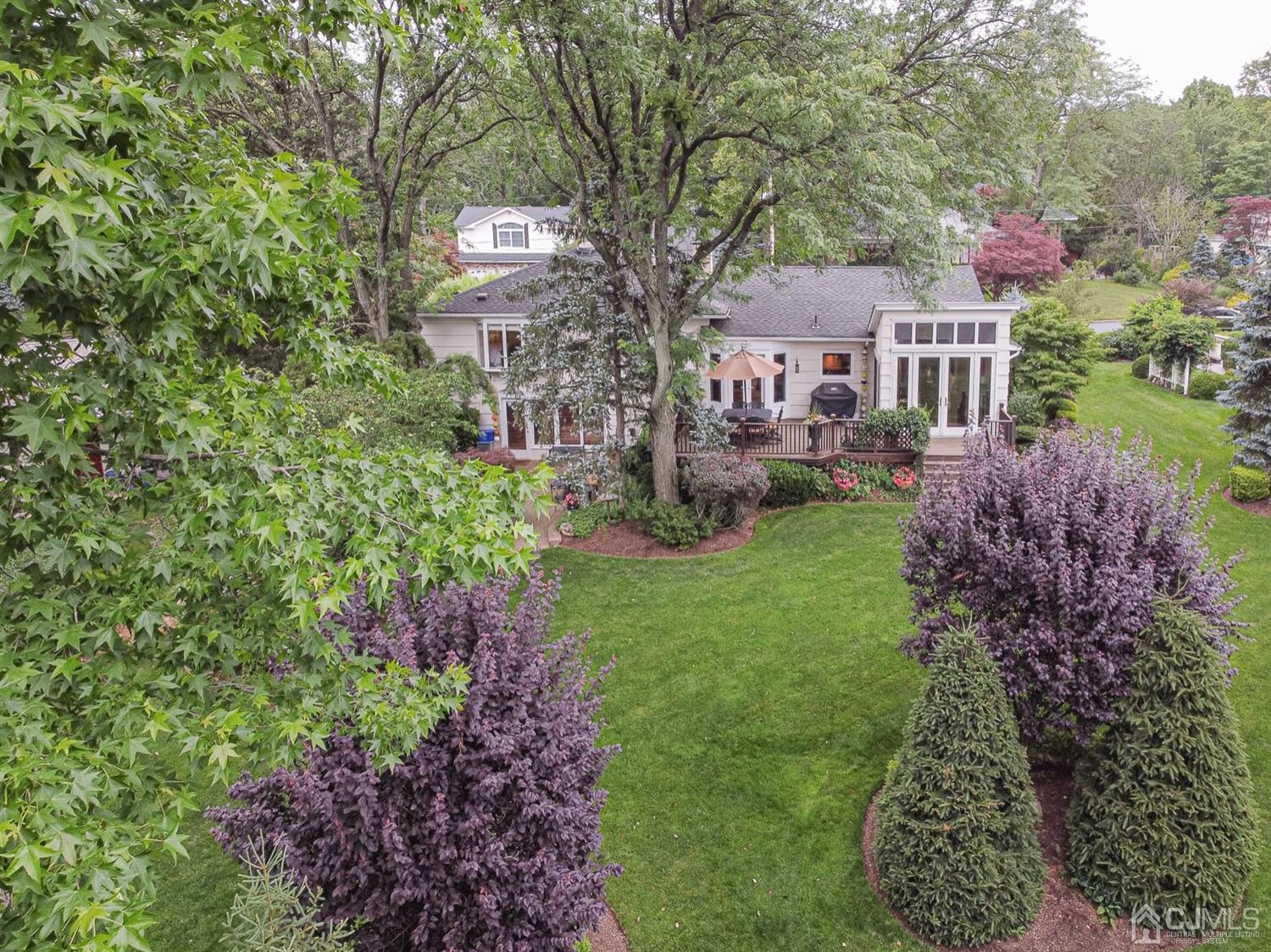 4 Moraine Road Edison, NJ 08820 - Photo 50 of 57 a front view of a house with a garden