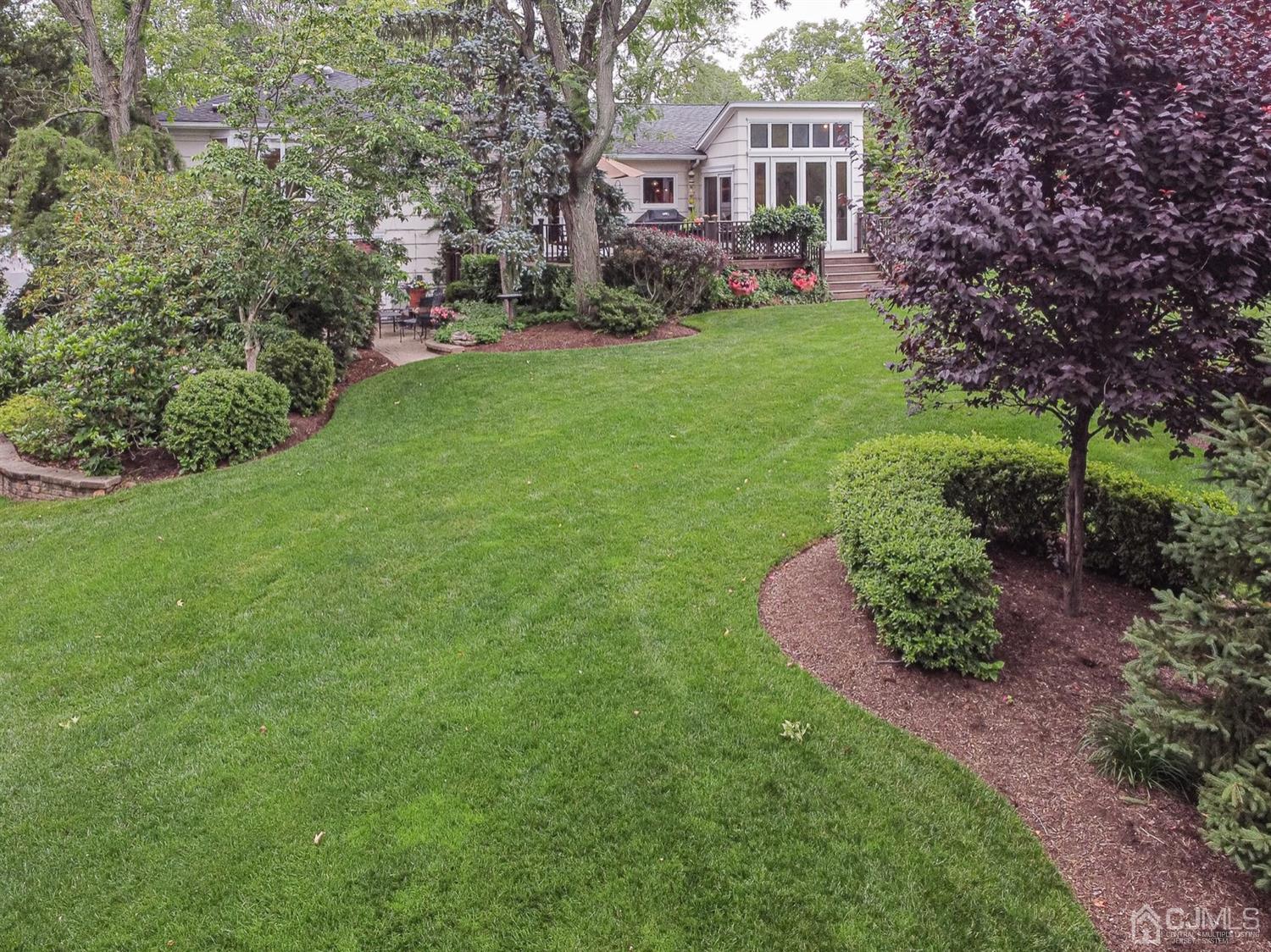 4 Moraine Road Edison, NJ 08820 - Photo 52 of 57 a view of a house with a yard table and chairs