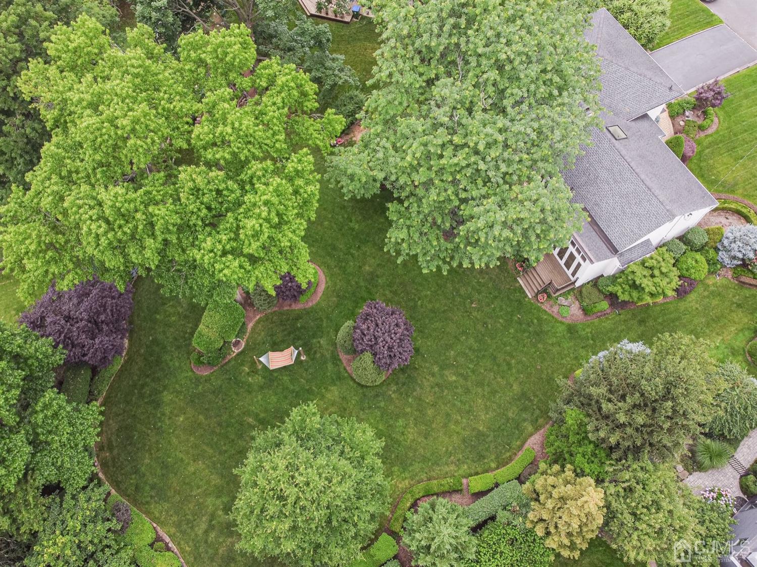 4 Moraine Road Edison, NJ 08820 - Photo 55 of 57 a view of a table and chairs in a garden