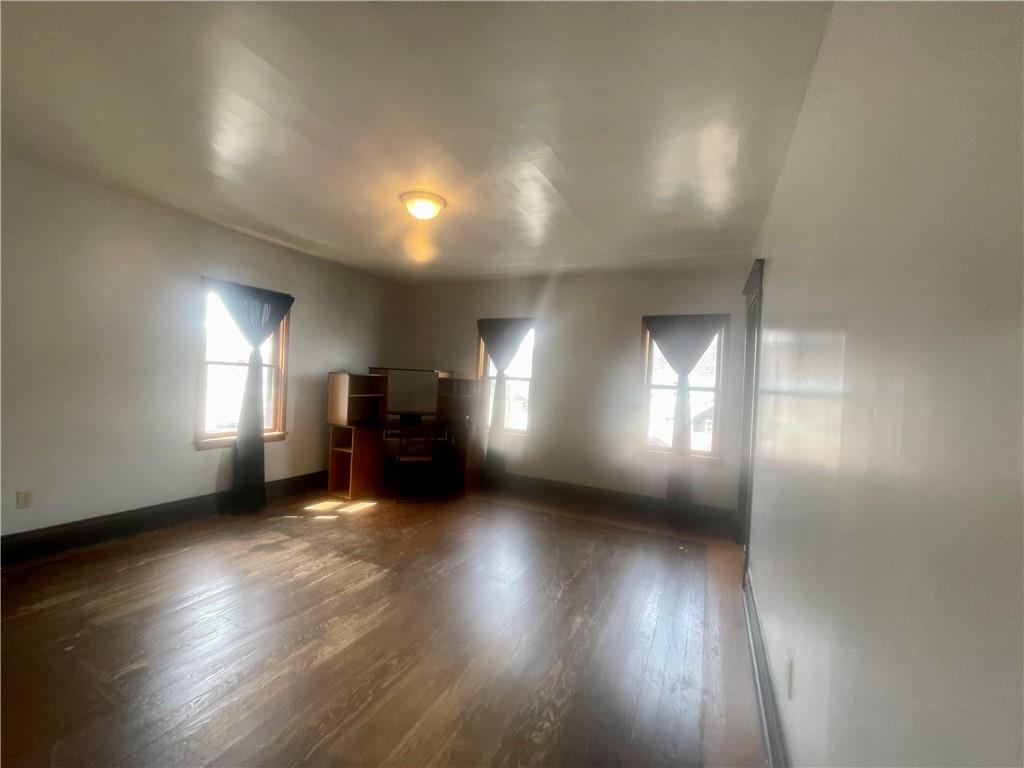 634 Ridge Avenue Ford City, PA 16226 - Photo 12 of 15 an empty room with wooden floor and windows