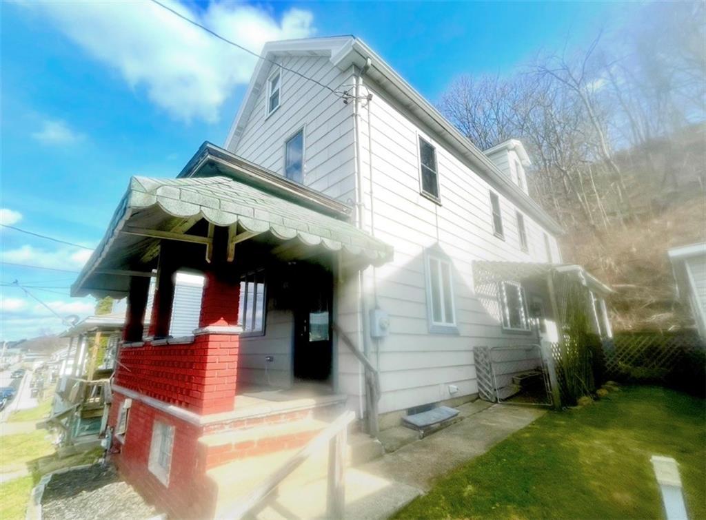 634 Ridge Avenue Ford City, PA 16226 - Photo 2 of 15 a front view of a house with a yard
