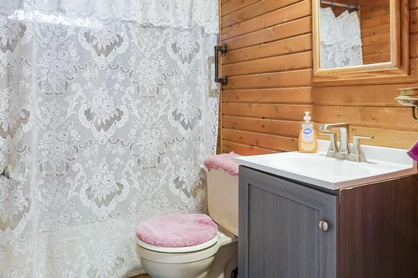 a living room with furniture and a staircase