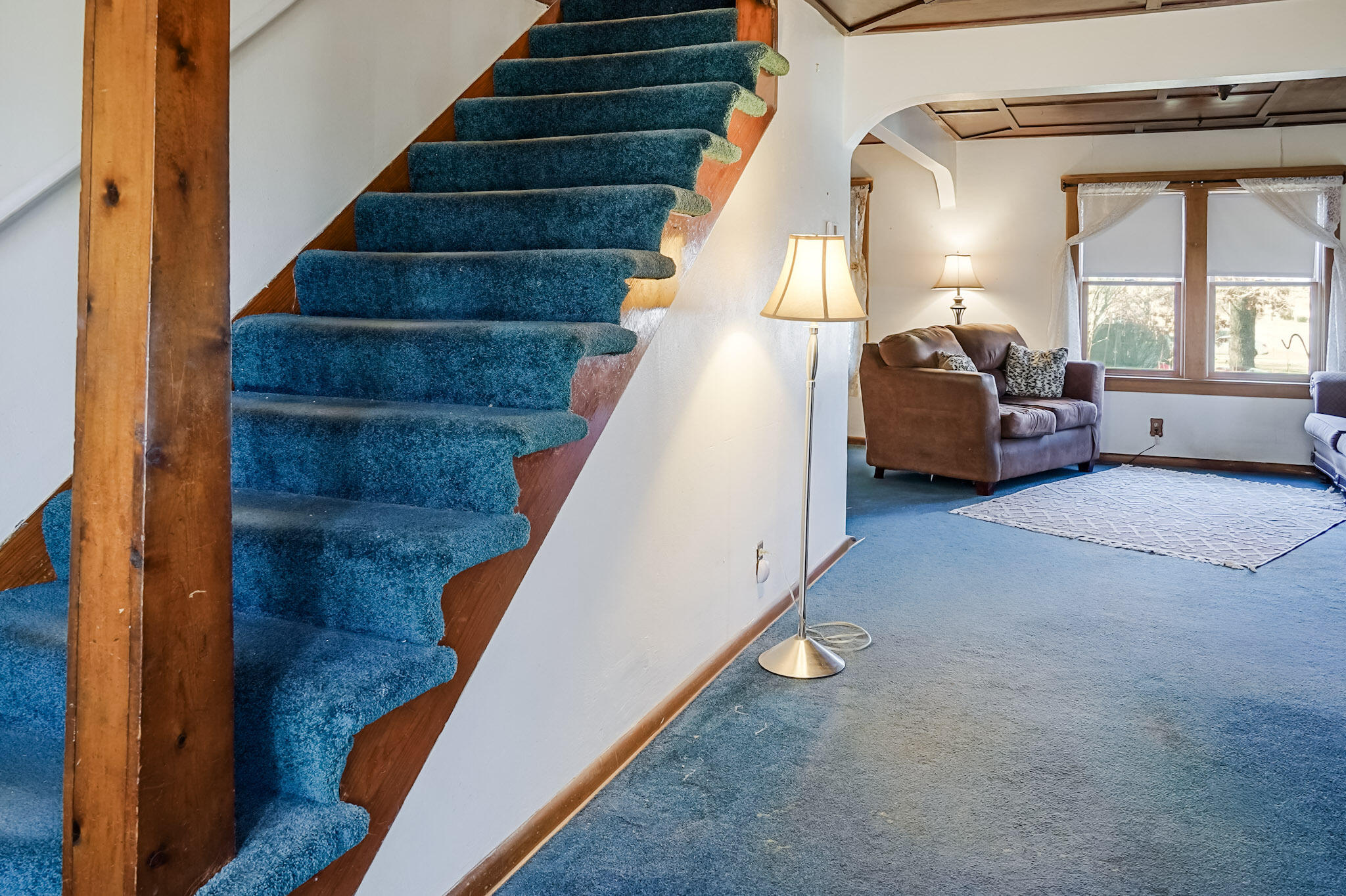 6665 Old Porter Road Portage, IN 46368 - Photo 12 of 20 a living room with furniture and a staircase