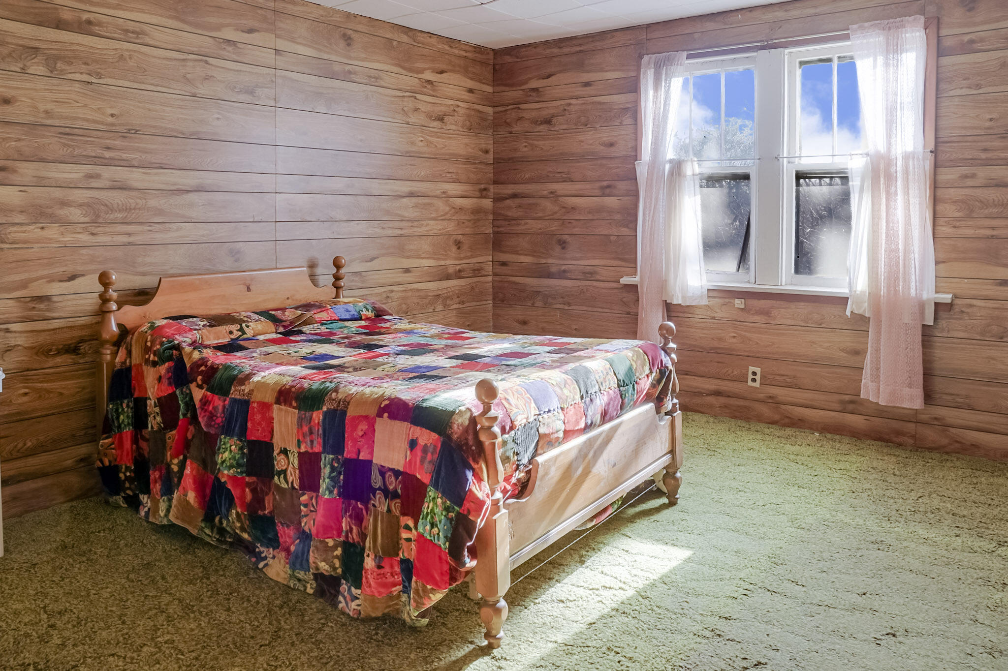 6665 Old Porter Road Portage, IN 46368 - Photo 13 of 20 a bed sitting in a room next to a window