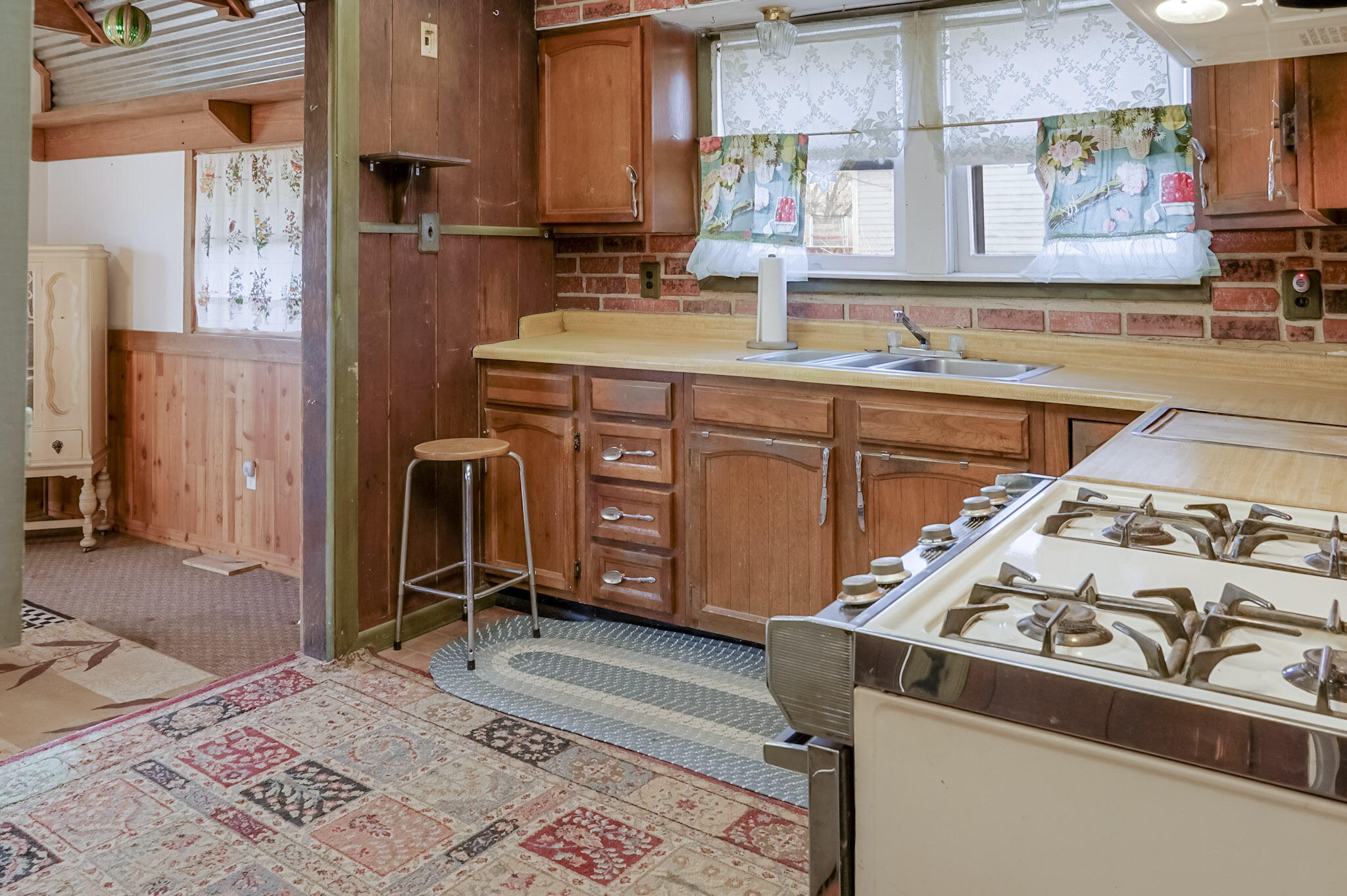 6665 Old Porter Road Portage, IN 46368 - Photo 5 of 20 a kitchen with stainless steel appliances granite countertop a sink stove and refrigerator