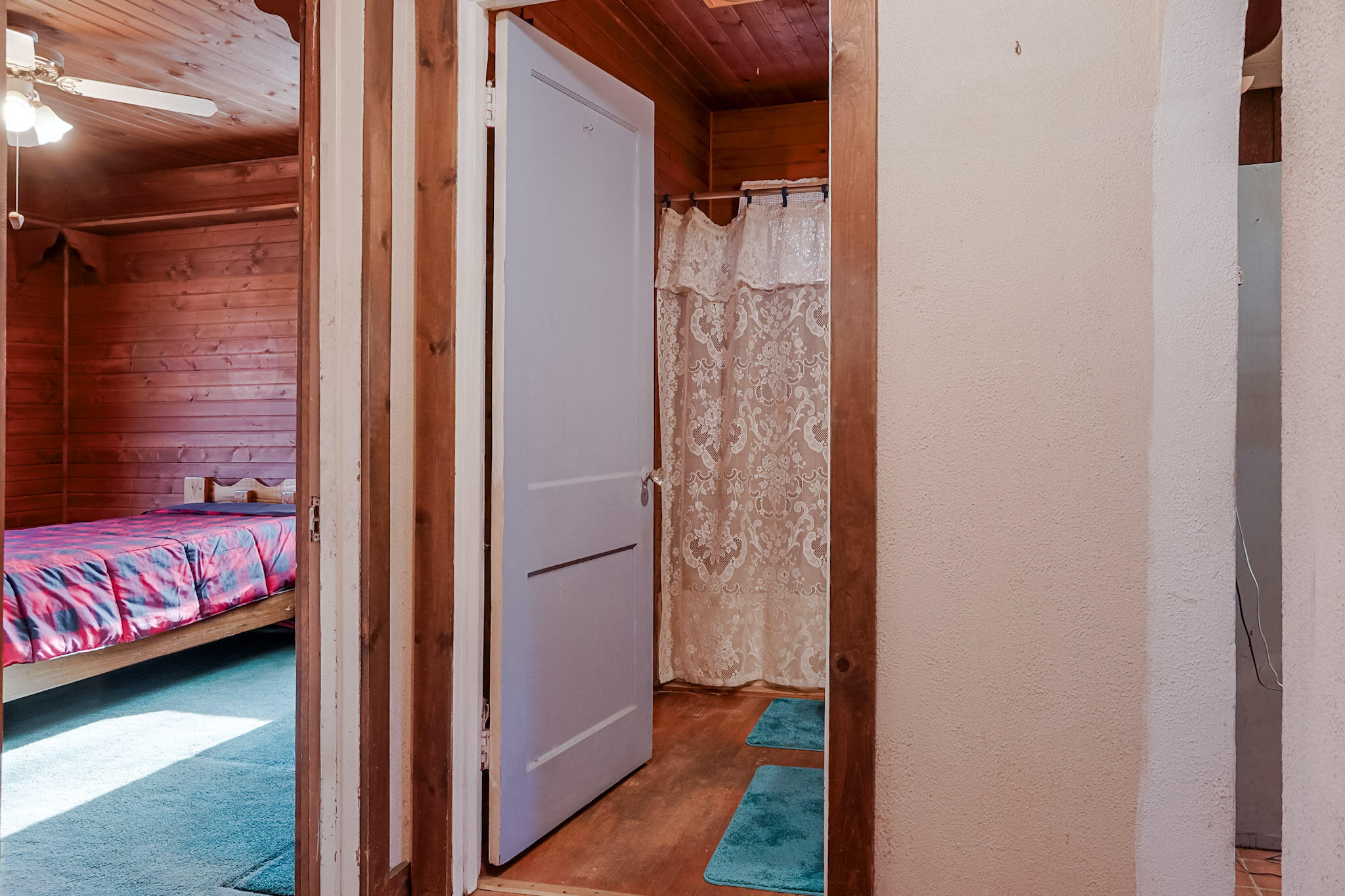 6665 Old Porter Road Portage, IN 46368 - Photo 10 of 20 a view of a bedroom with a bed and wooden floor