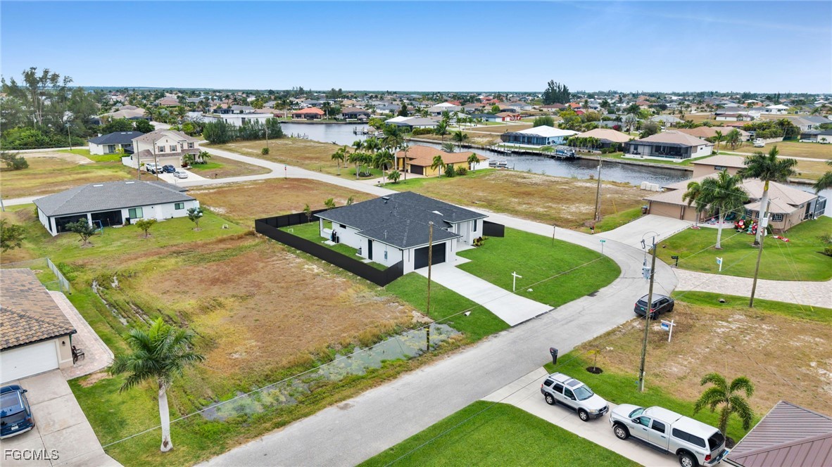 910 Northwest 36th Place Cape Coral, FL 33993 - Photo 42 of 46 an aerial view of residential houses with outdoor space