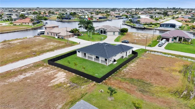 an aerial view of house with yard