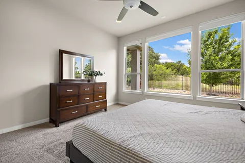 a bedroom with a bed and a dresser