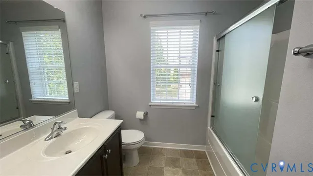 a bathroom with a sink a toilet and tub