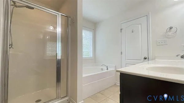 a bathroom with a bathtub and a sink