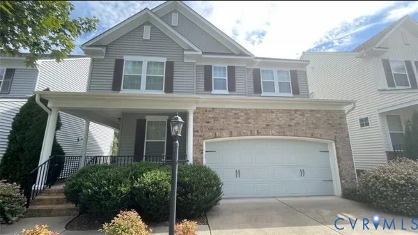a front view of a house with garage