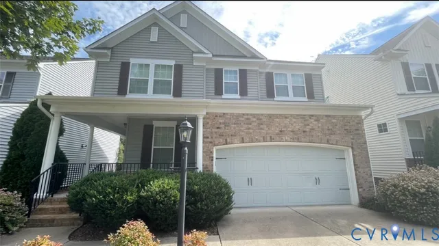 a front view of a house with garage