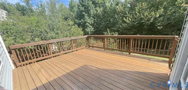a view of balcony with wooden floor