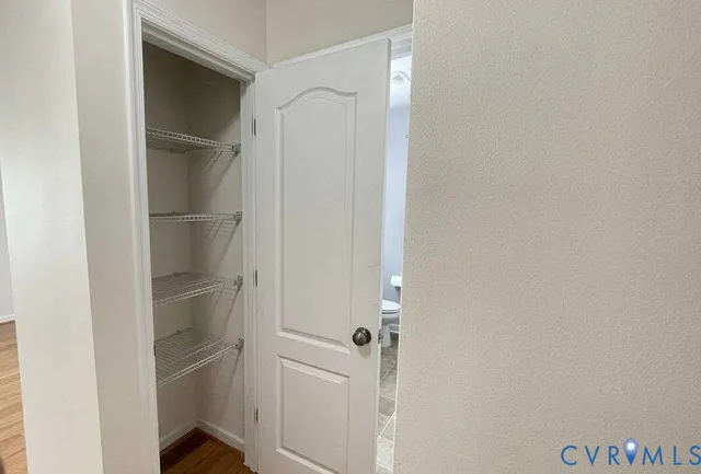 a view of an empty walk in closet