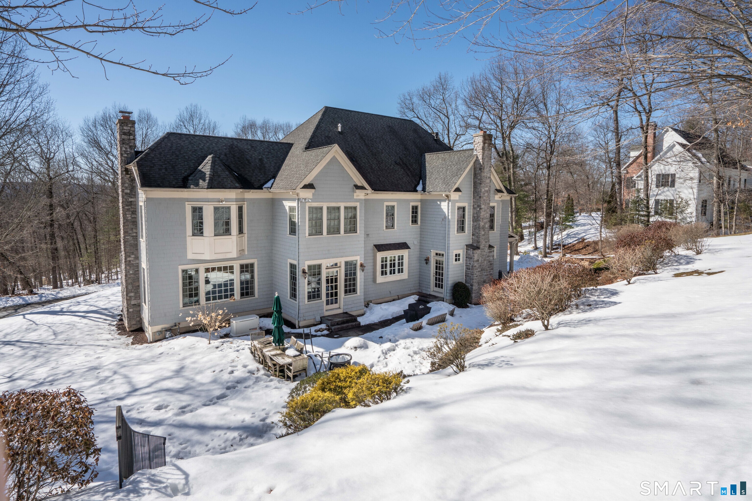 51 Westland Road Avon, CT 06001 - Photo 11 of 48 a view of a house with snow on the side of the road