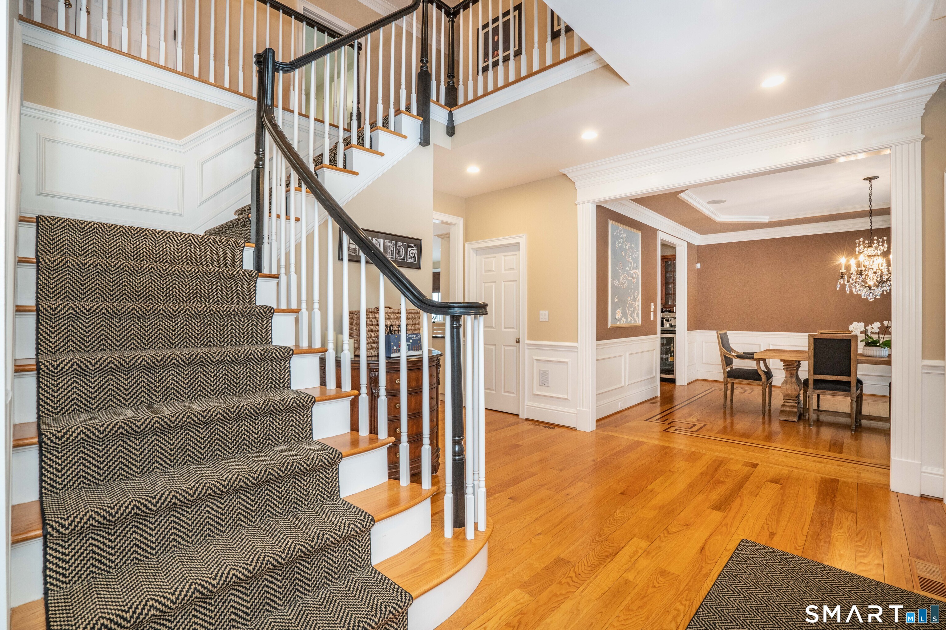 51 Westland Road Avon, CT 06001 - Photo 13 of 48 a view of entryway and dining room and hall with wooden floor