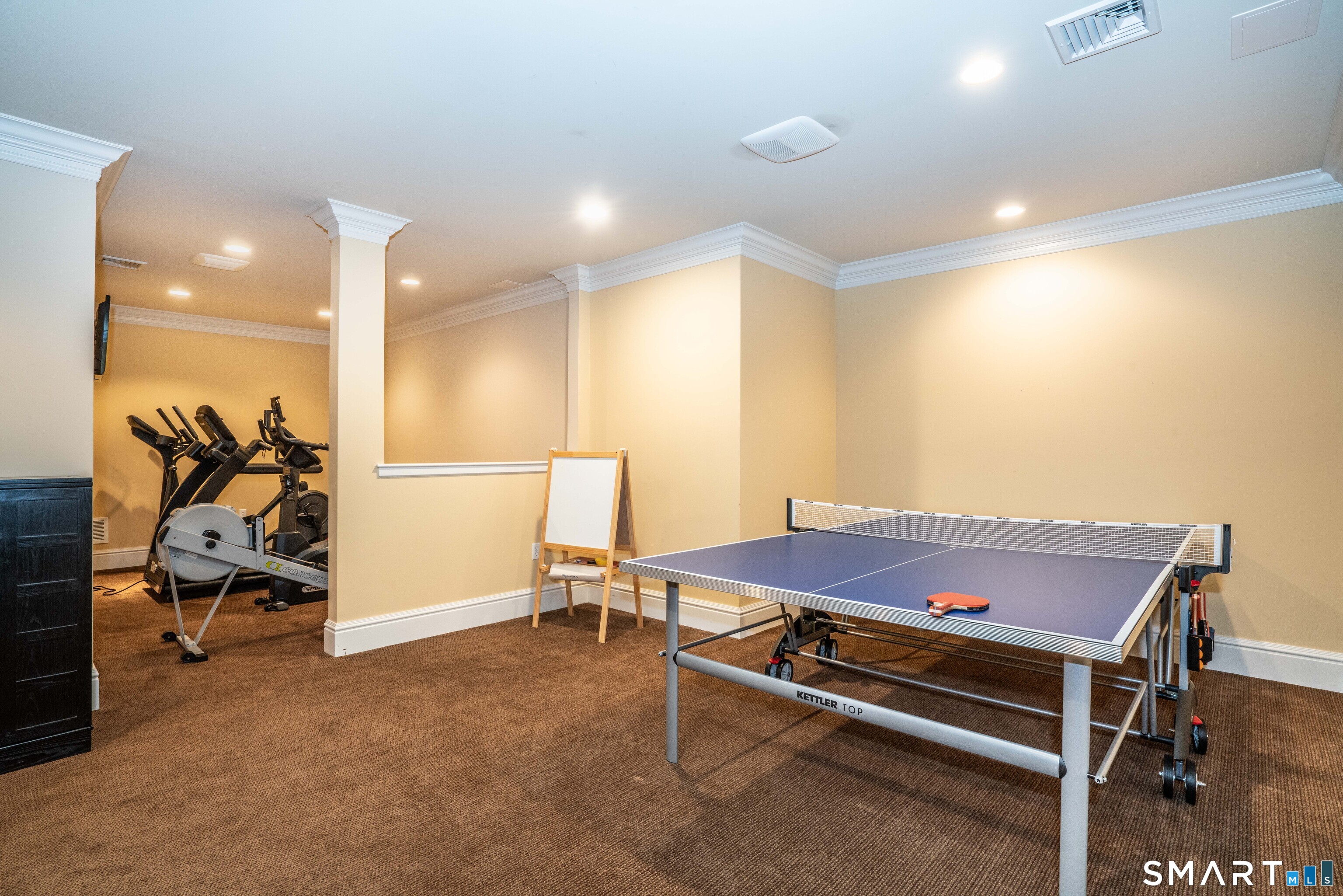 51 Westland Road Avon, CT 06001 - Photo 9 of 48 a room with furniture and air hockey table