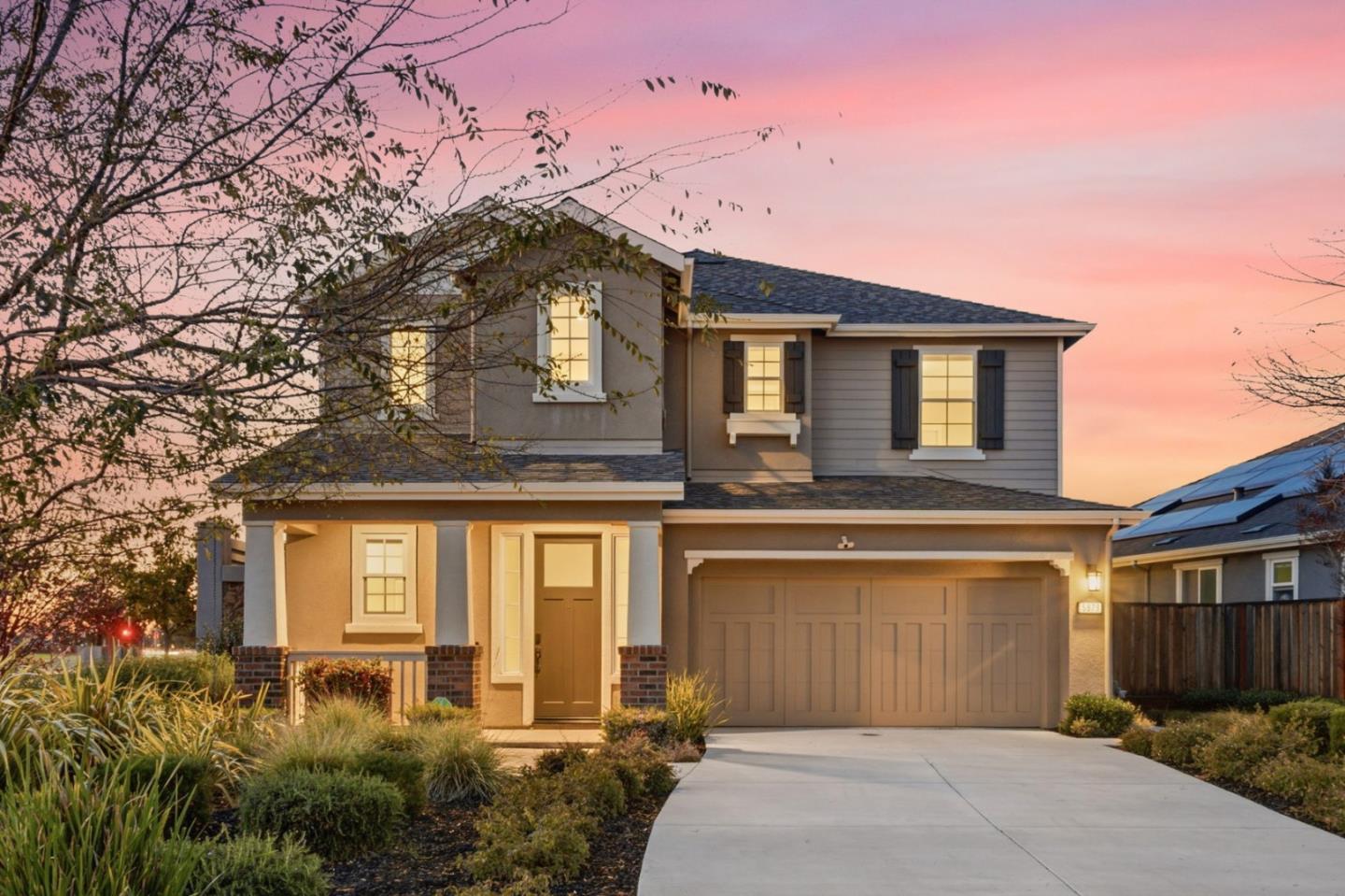 a front view of a house with a yard