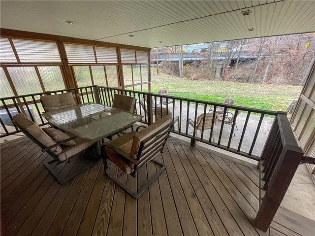 a view of a balcony with chairs