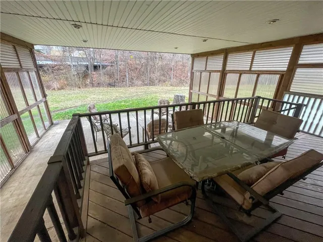 a view of a balcony with furniture